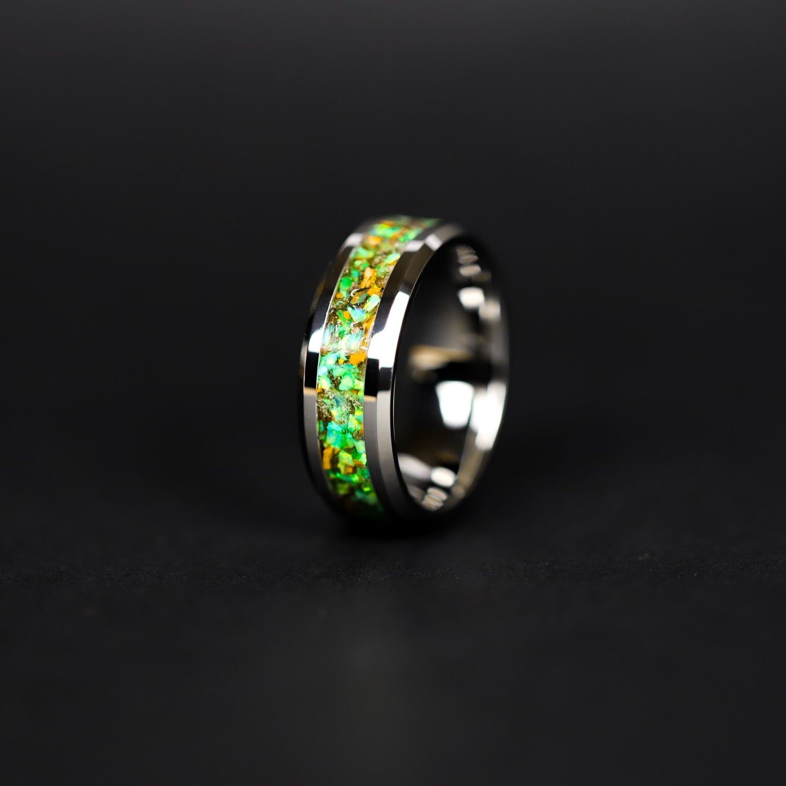 8mm tungsten ring with authentic Velociraptor bone and Campo del Cielo meteorite in lime green opal inlay glowing green in the dark