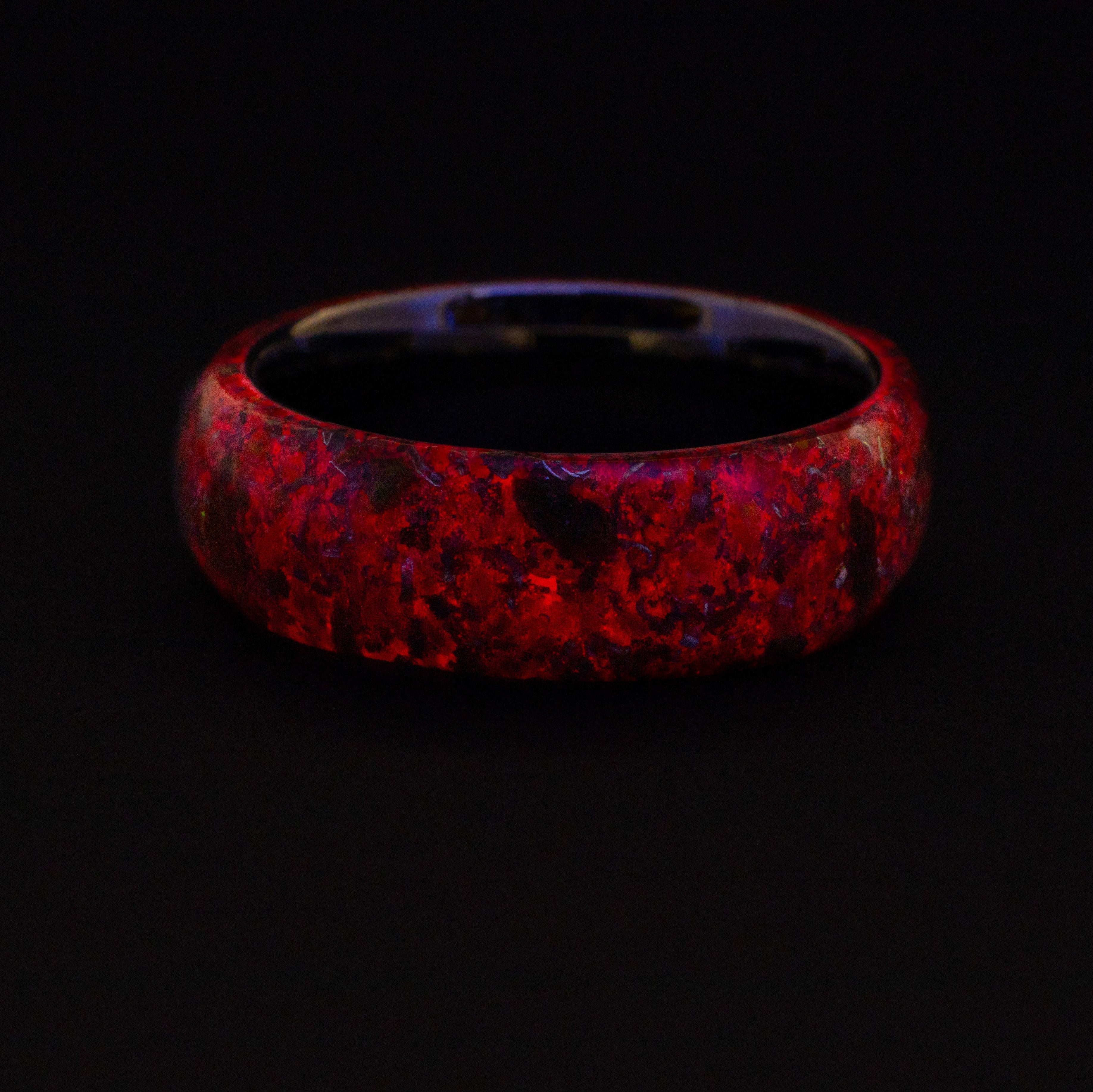 red glow-in-the-dark inlay.  Endless tungsten ring featuring authentic prehistoric fossil and vibrant red glow-in-the-dark inlay.