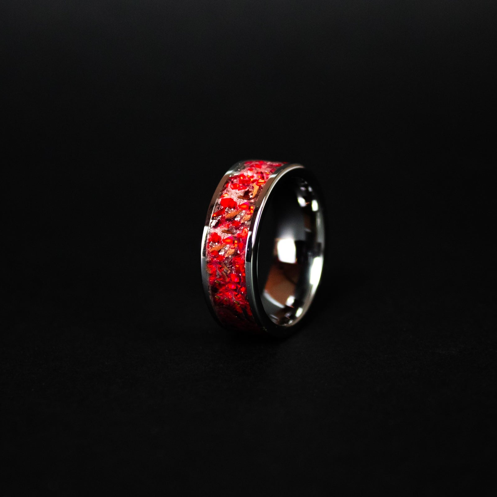 8mm wide channel tungsten ring with authentic T-Rex bone and Campo del Cielo meteorite in red opal inlay glowing red in the dark