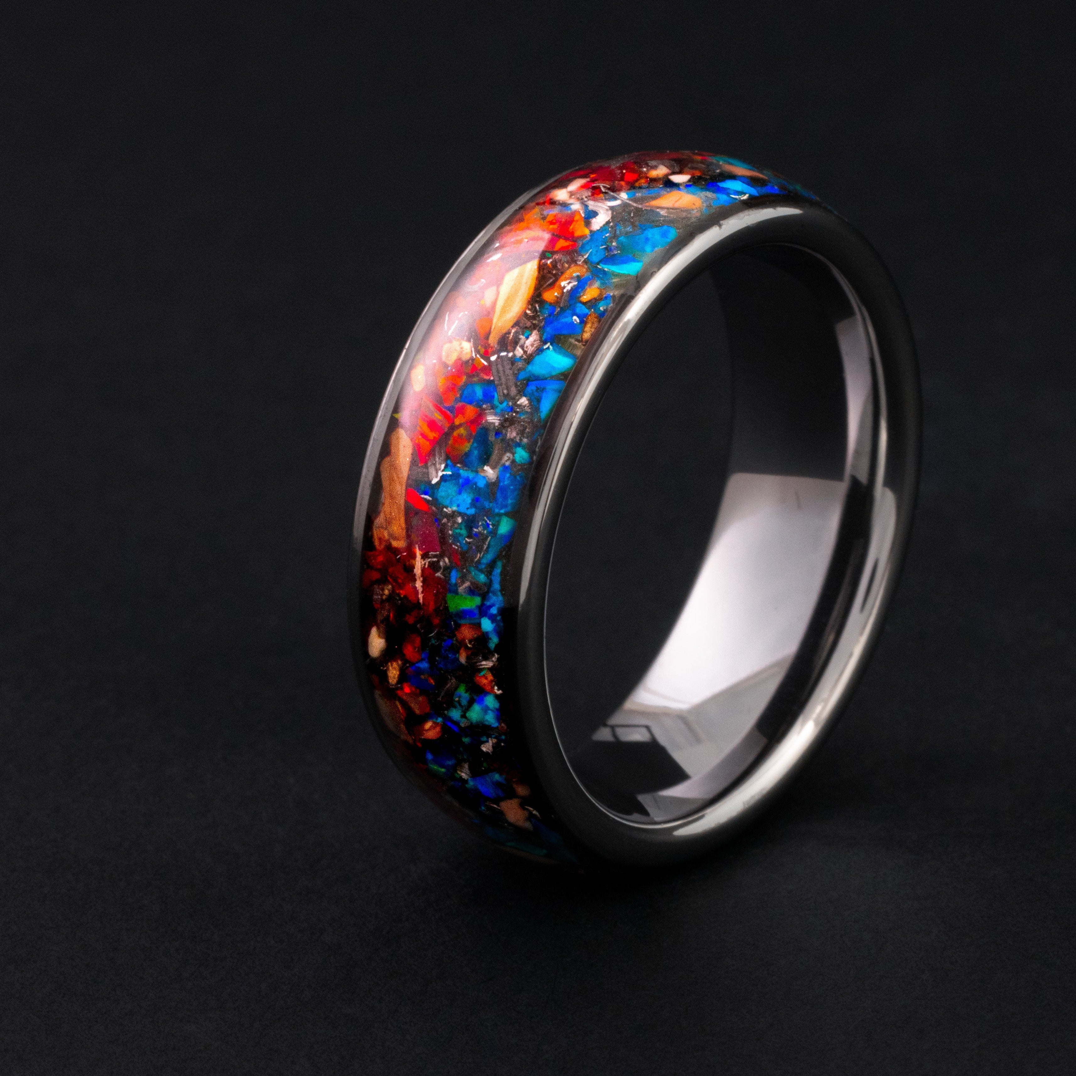 8mm tungsten wedding band featuring prehistoric fossil and vibrant opal inlay.