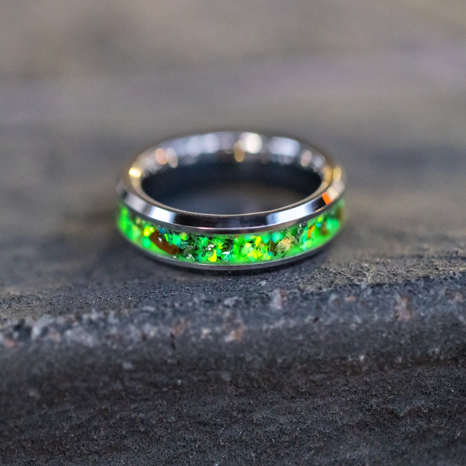 Handcrafted 6mm tungsten mens wedding band with authentic Velociraptor bone and Campo del Cielo meteorite in lime green opal green glow inlay made in California