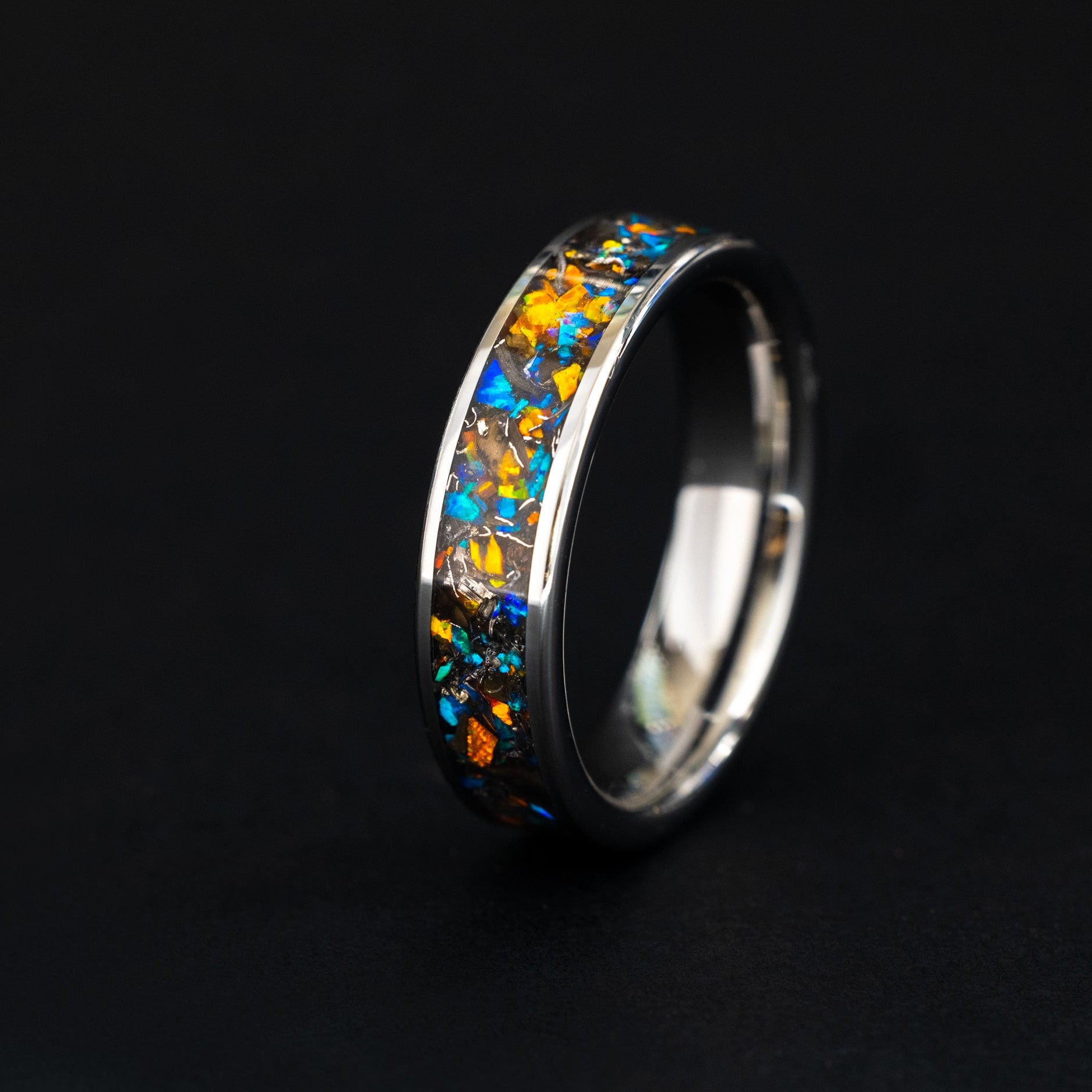 Handcrafted 6mm tungsten wedding band featuring celestial meteorite fragments and dual-tone opal.