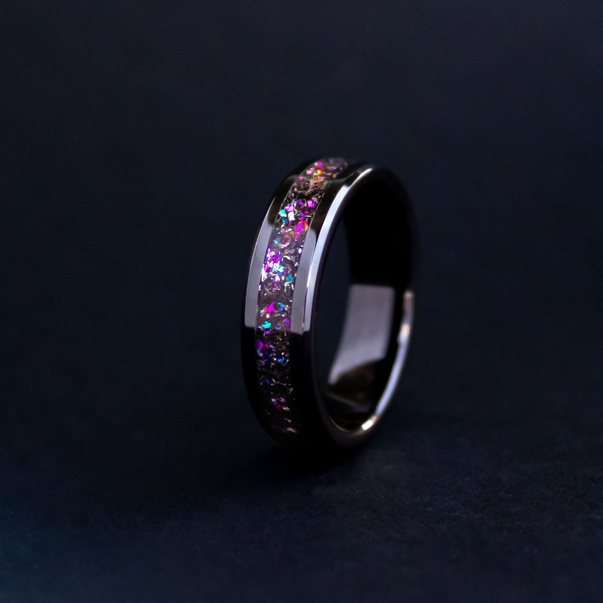 Handcrafted 6mm beveled black ceramic mens wedding band with authentic Gibeon meteorite in pink and purple galaxy glitter inlay made in California