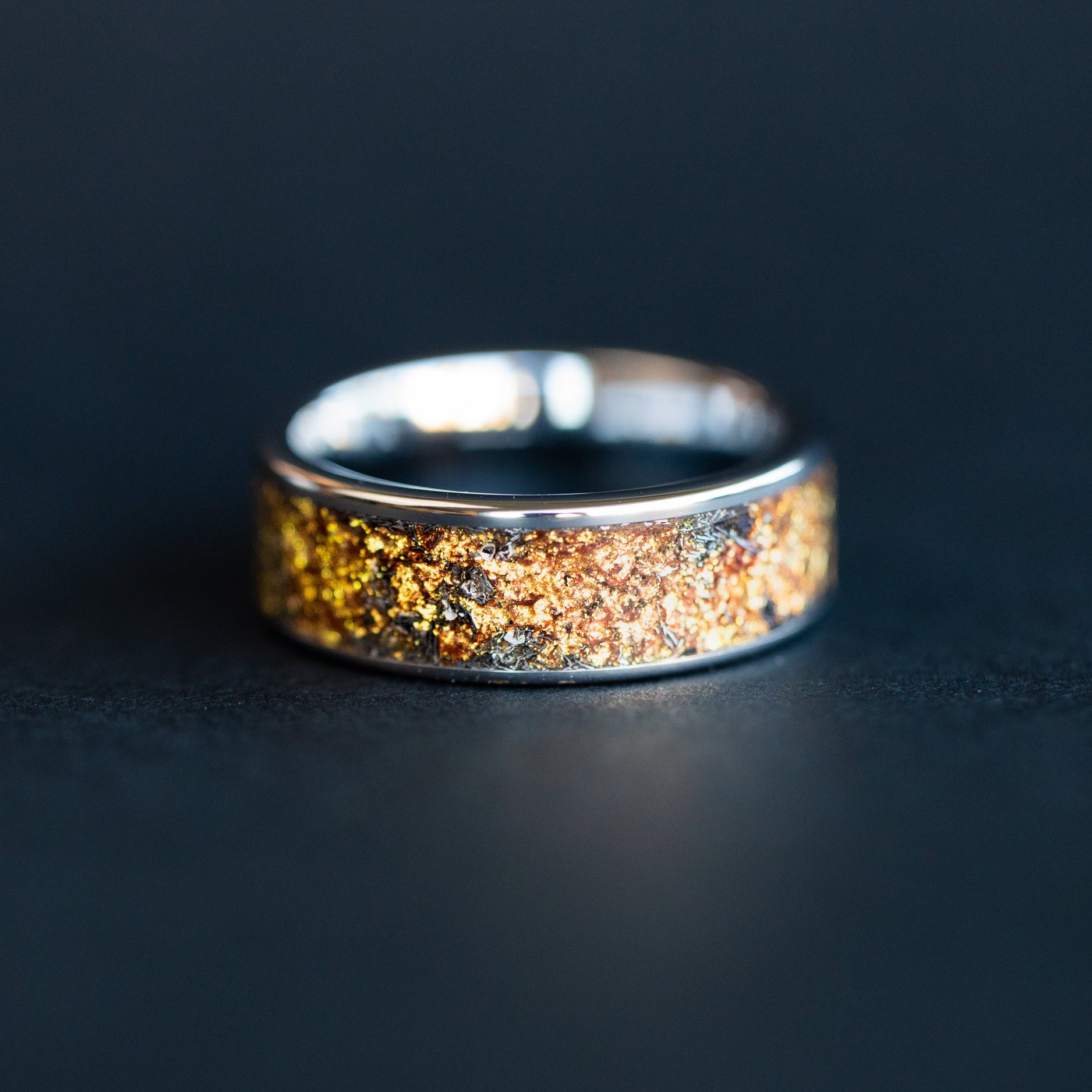 Handcrafted 8mm wide channel tungsten mens wedding band with authentic Campo del Cielo meteorite and gold galaxy pigment inlay made in California