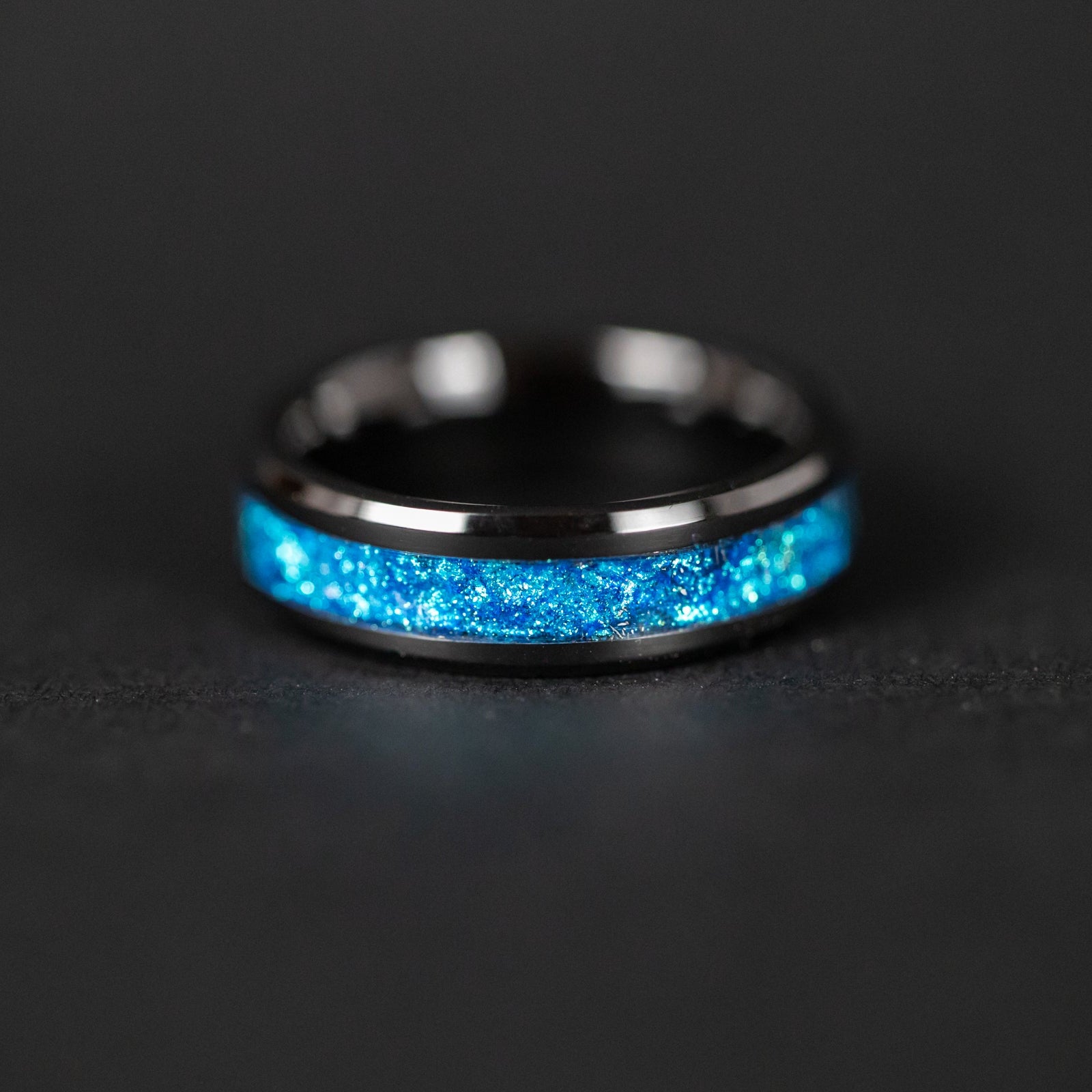 Handcrafted 6mm beveled black ceramic mens wedding band with authentic Campo del Cielo meteorite in blue glitter pigment inlay made in California