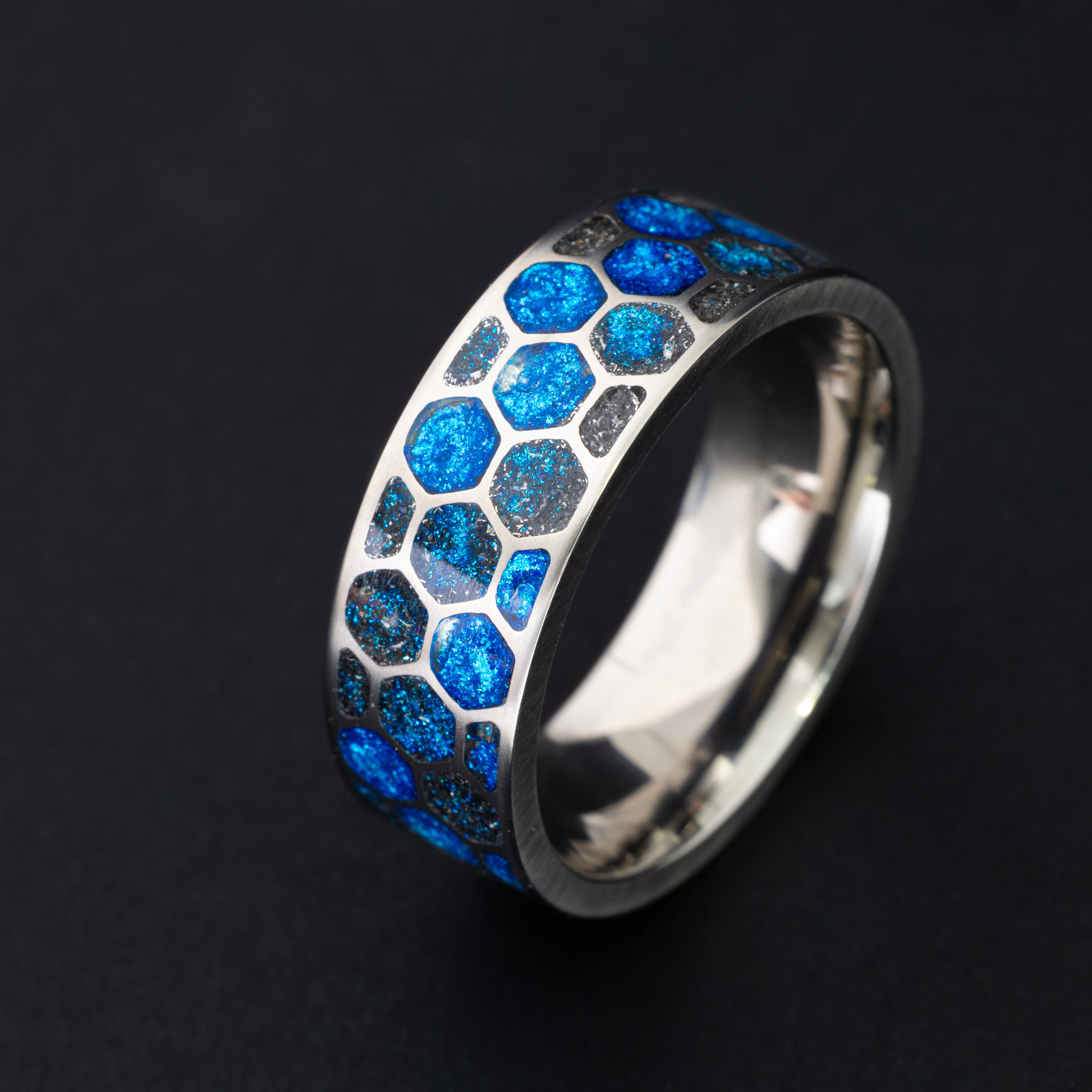 Handcrafted 8mm titanium honeycomb mens wedding band with authentic Campo del Cielo meteorite in blue resin blue glow filled cells made in California