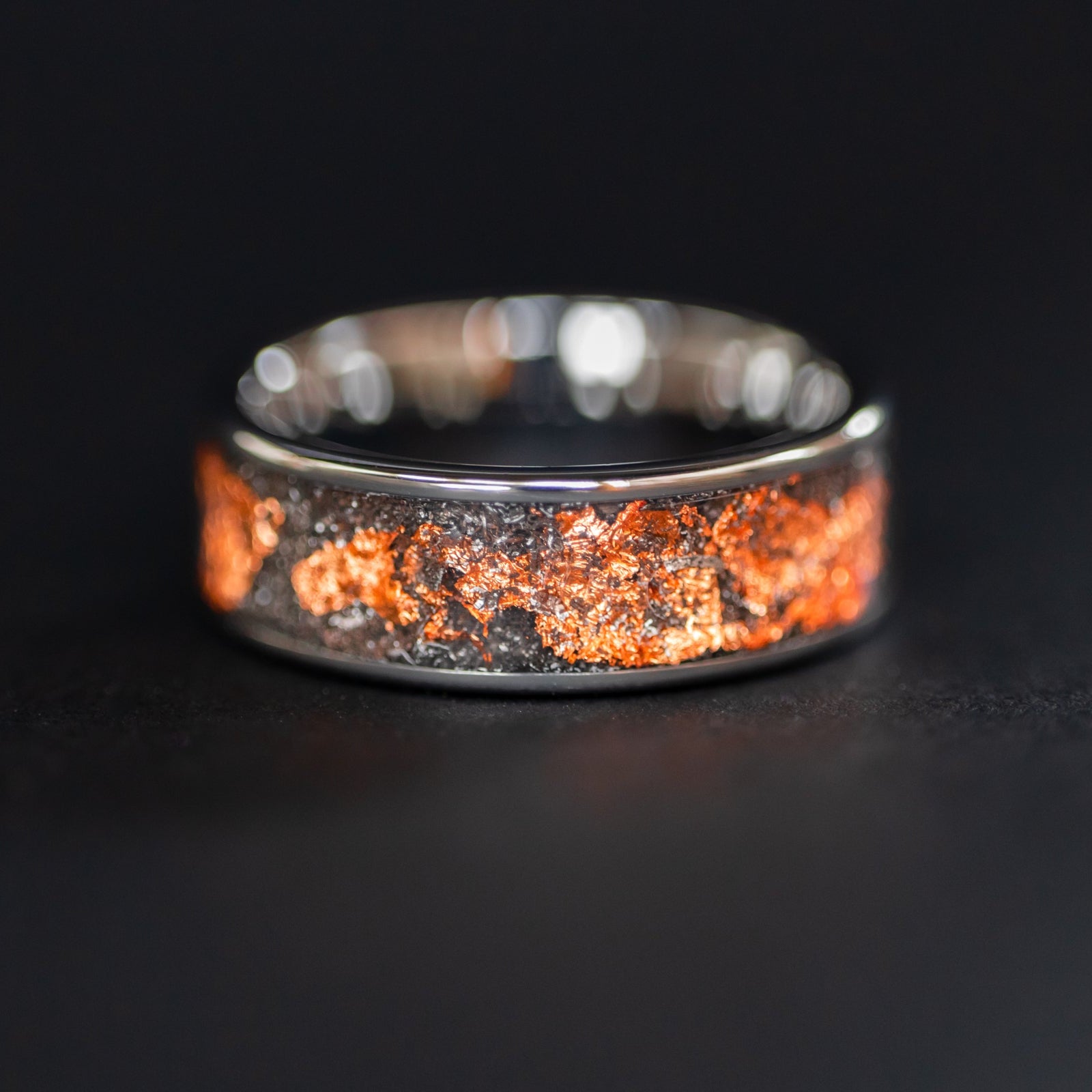 Handcrafted 8mm wide channel tungsten mens wedding band with authentic Campo del Cielo meteorite and copper flake inlay made in California