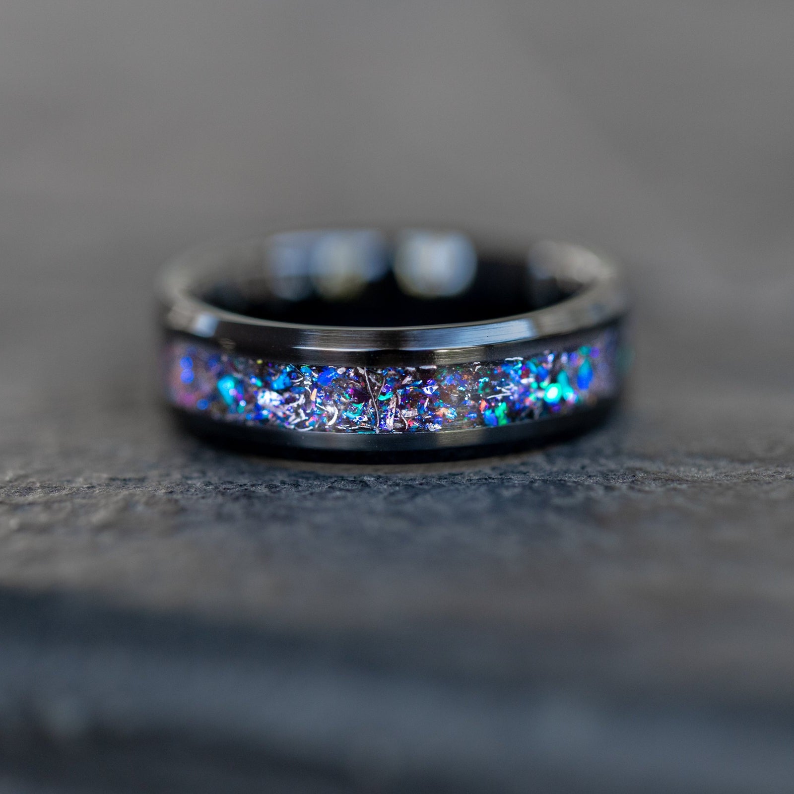 Handcrafted beveled black ceramic mens wedding band with authentic Campo del Cielo meteorite and blue purple opal galaxy inlay made in California