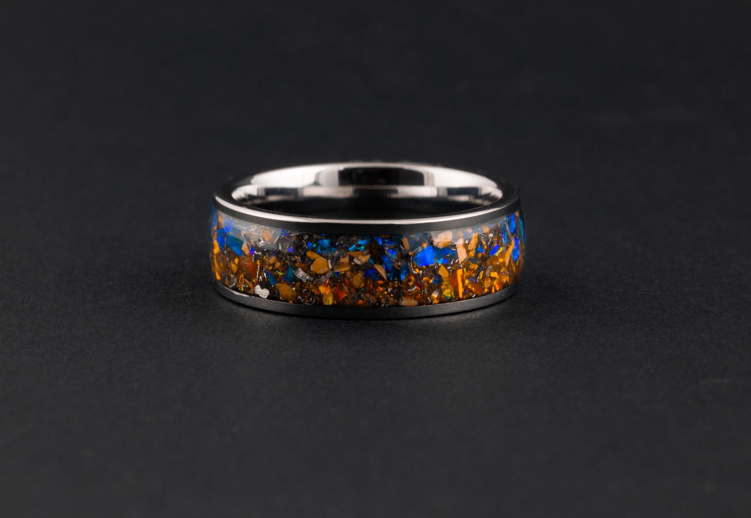 Unique silver tungsten wedding band featuring genuine fossilized bone and space meteorite.