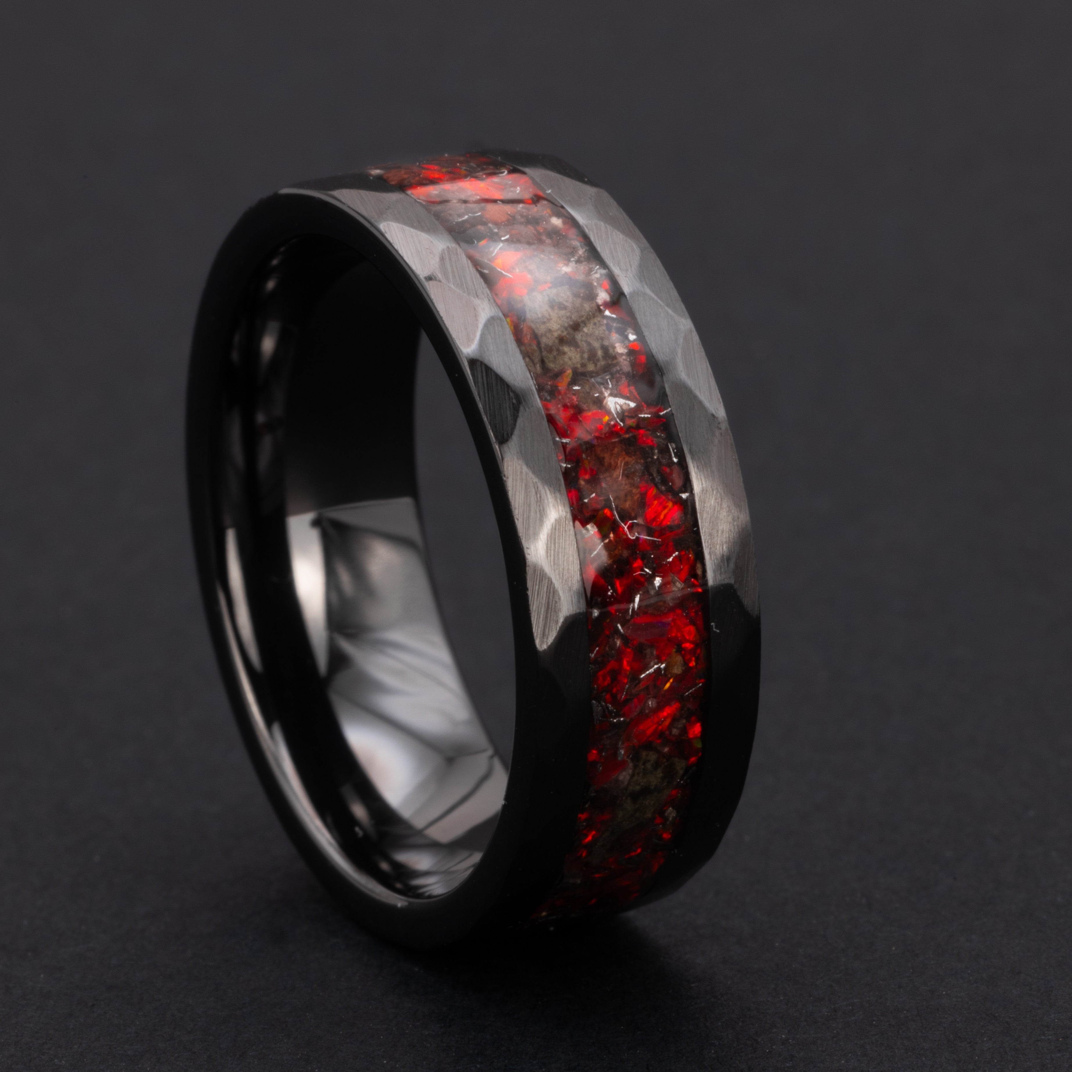 Handcrafted hammered black ceramic mens wedding band with authentic T-Rex bone and Martian meteorite in red opal inlay made in California