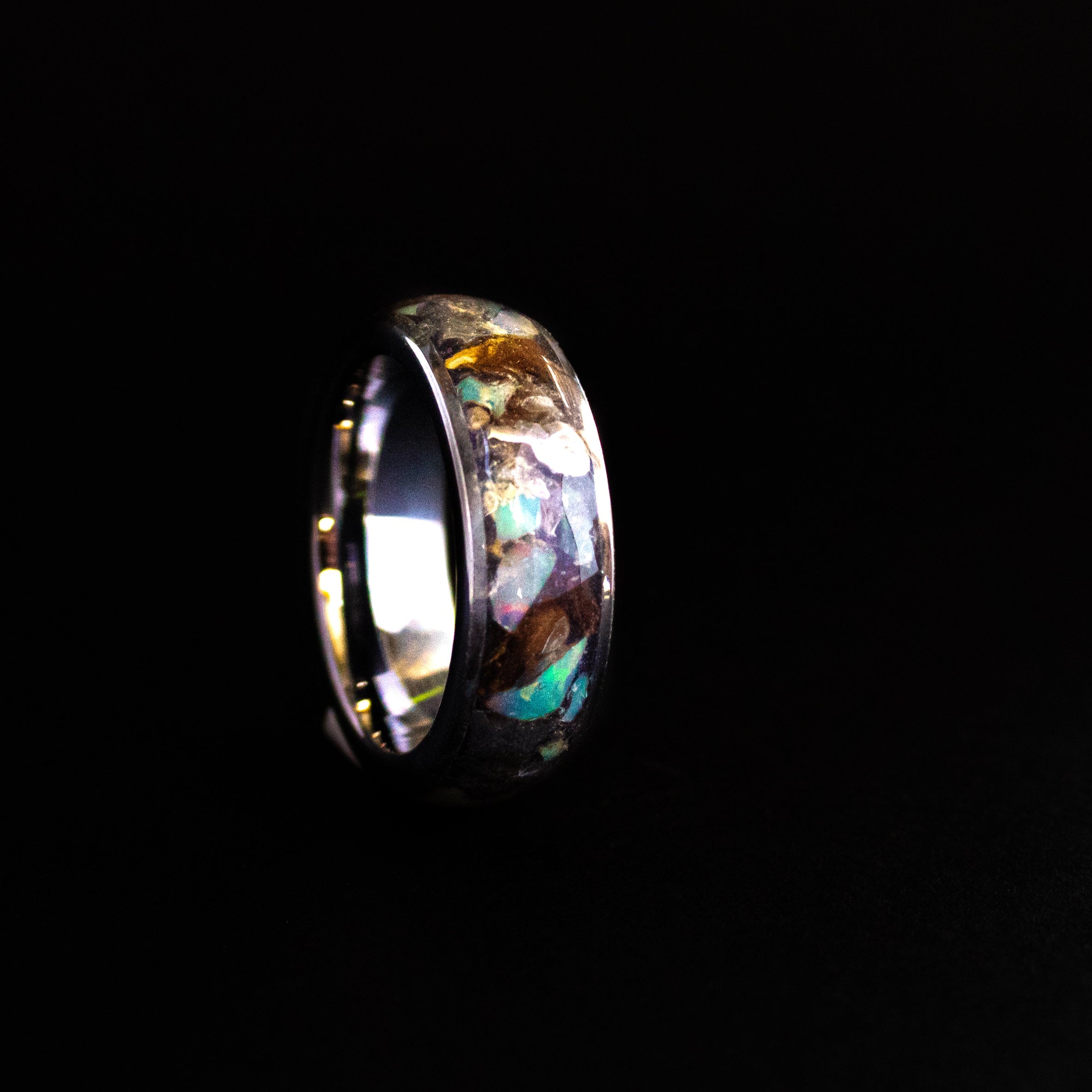 Handcrafted 8mm wide channel tungsten mens wedding band with large authentic T-Rex bone, Campo del Cielo meteorite, and Ethiopian Opal pieces made in California