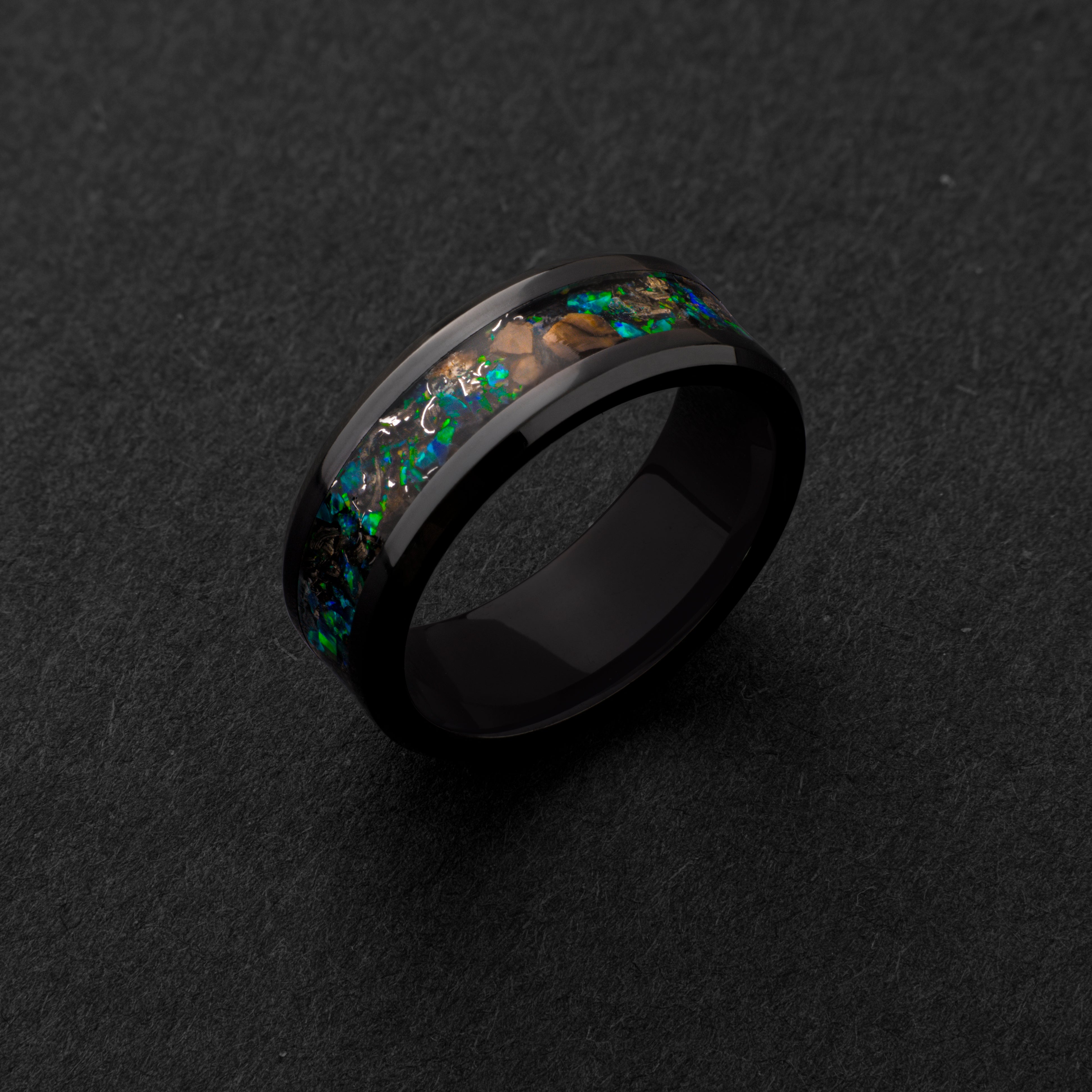 Handcrafted 8mm beveled black ceramic mens wedding band with authentic T-Rex bone and Campo del Cielo meteorite in green opal inlay made in California