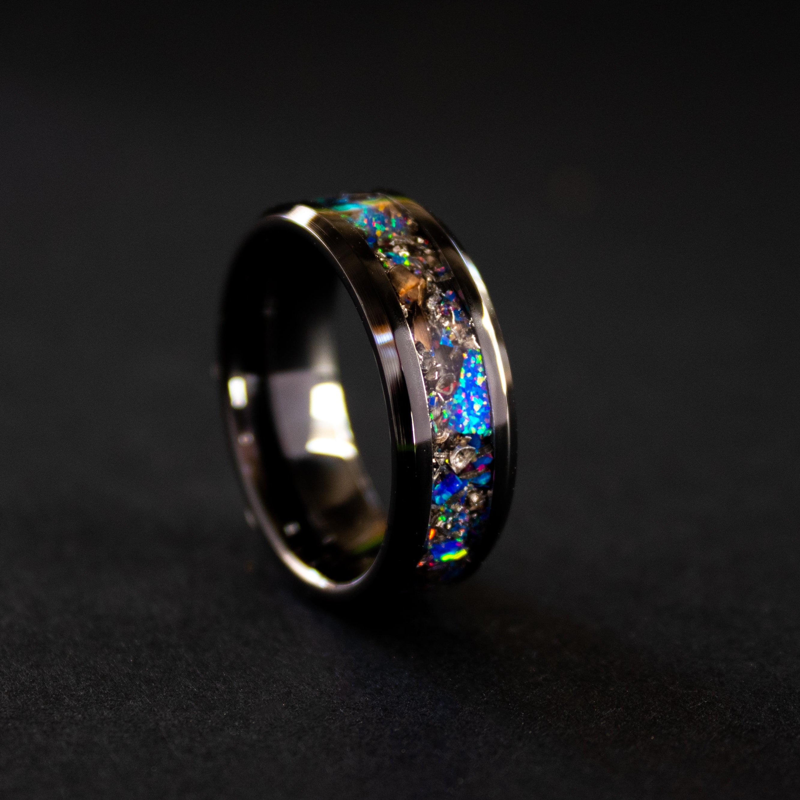 Handcrafted 8mm beveled black ceramic mens wedding band with authentic T-Rex bone and Campo del Cielo meteorite in midnight opal inlay made in California