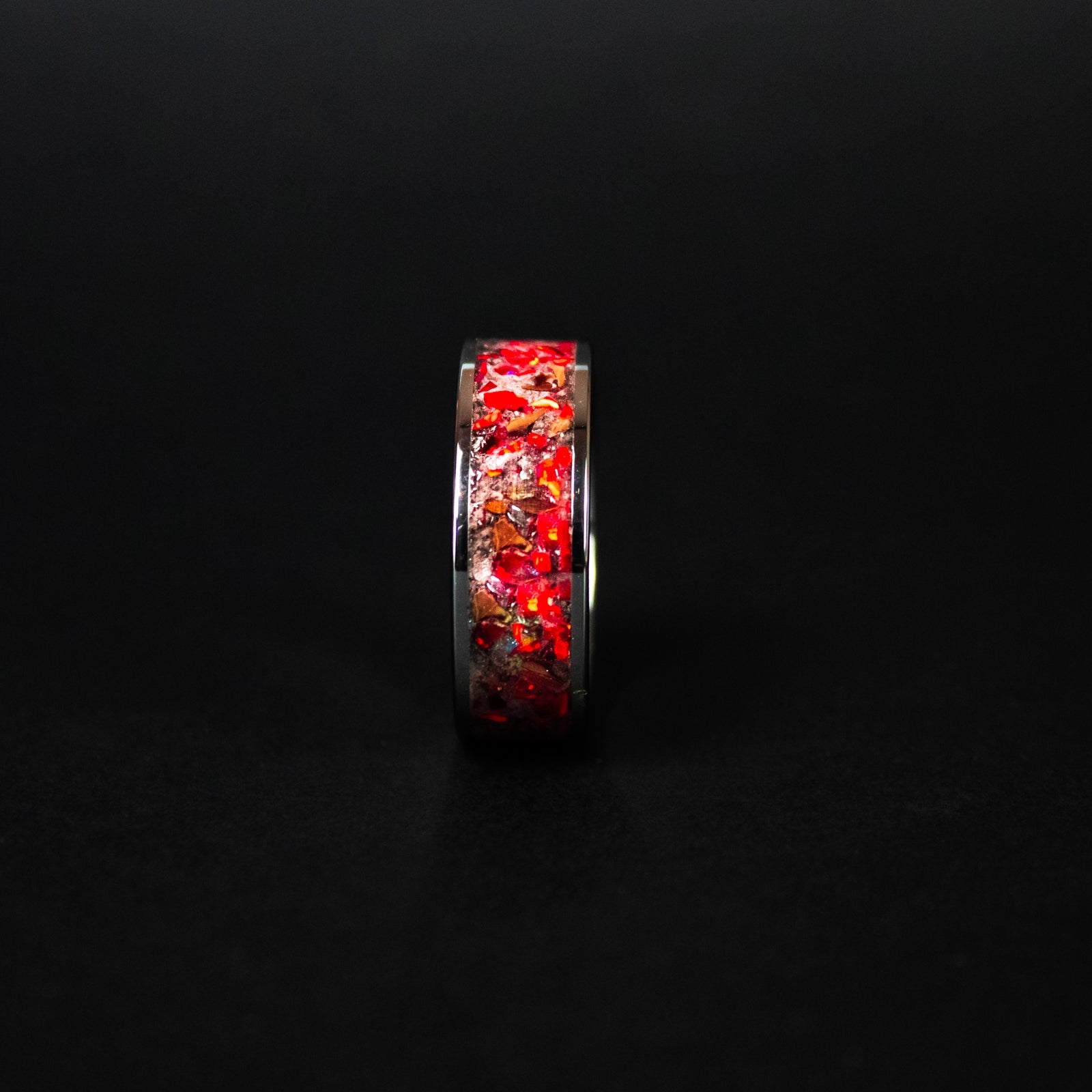 Handcrafted 8mm wide channel tungsten mens wedding band with authentic T-Rex bone and Campo del Cielo meteorite in red opal red glow inlay made in California