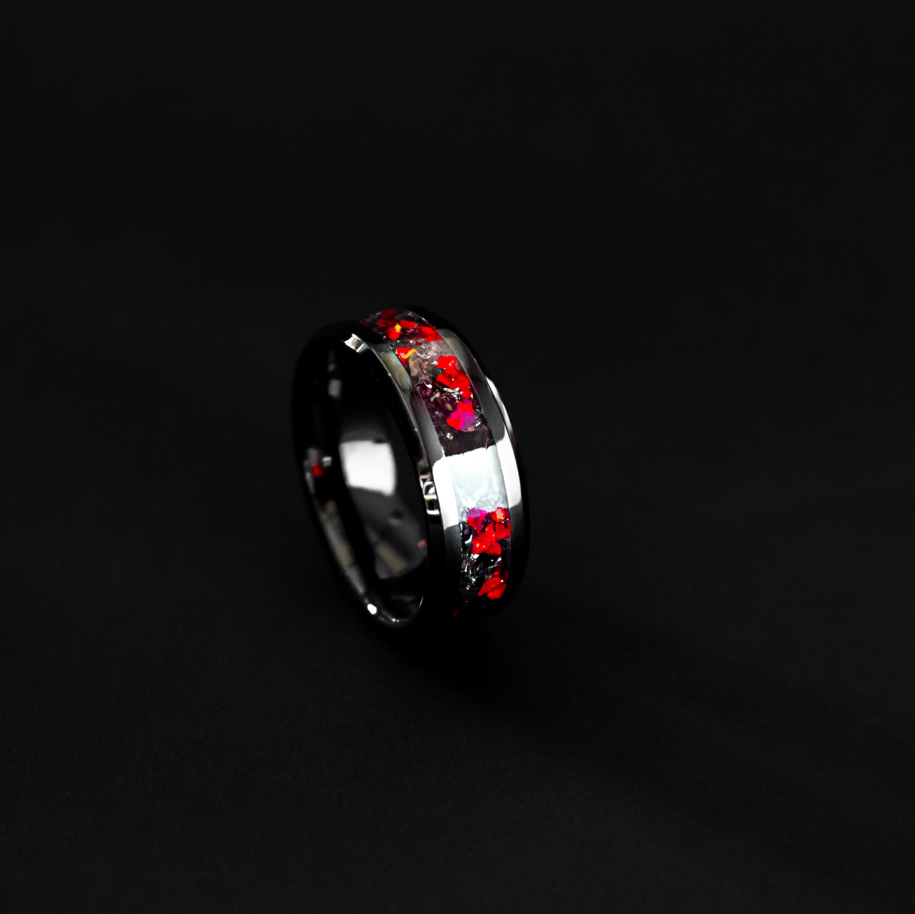 Handcrafted 8mm beveled black ceramic mens wedding band with authentic T-Rex bone and Campo del Cielo meteorite in red opal inlay made in California