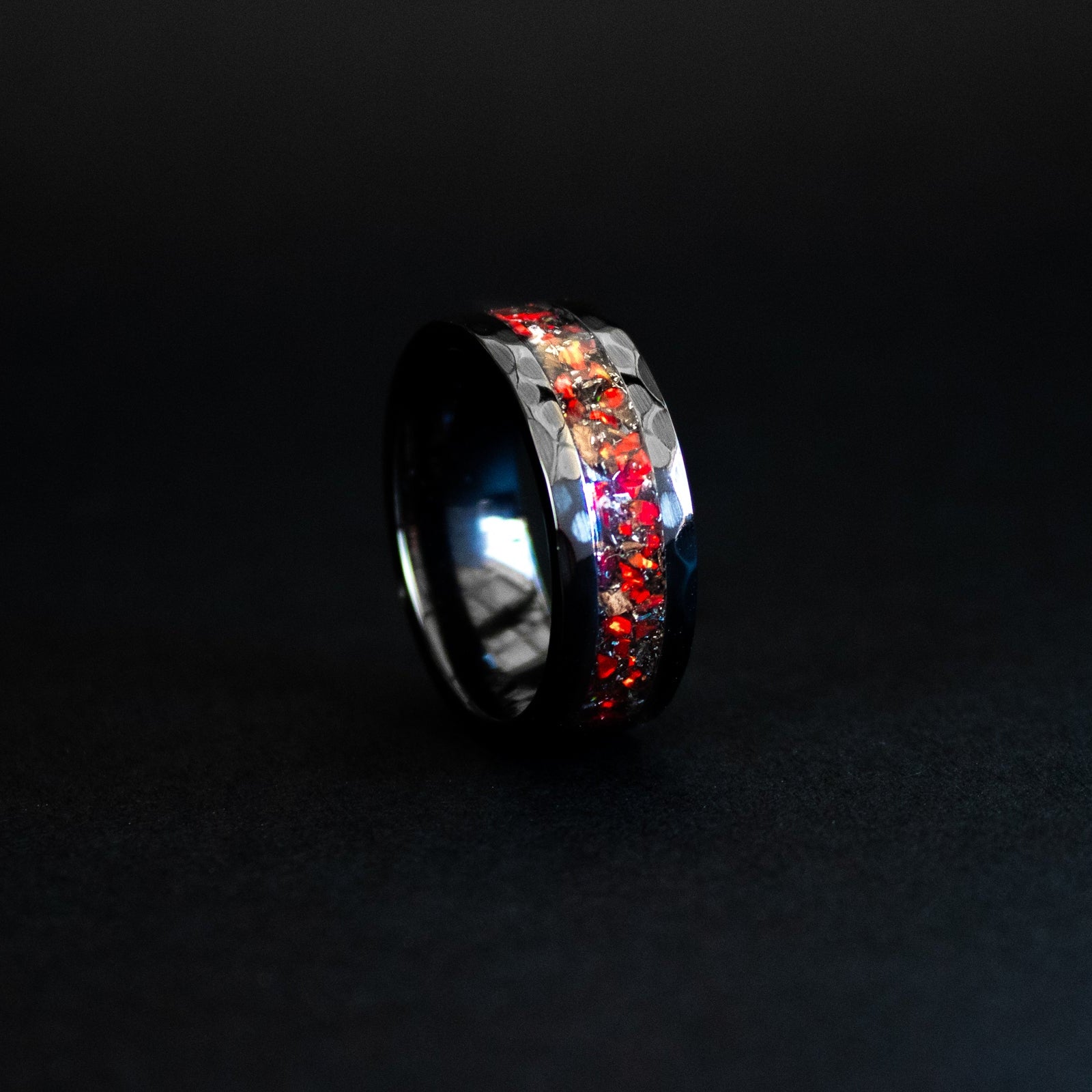 Handcrafted hammered black ceramic mens wedding band with authentic T-Rex bone and Campo del Cielo meteorite in red opal inlay made in California