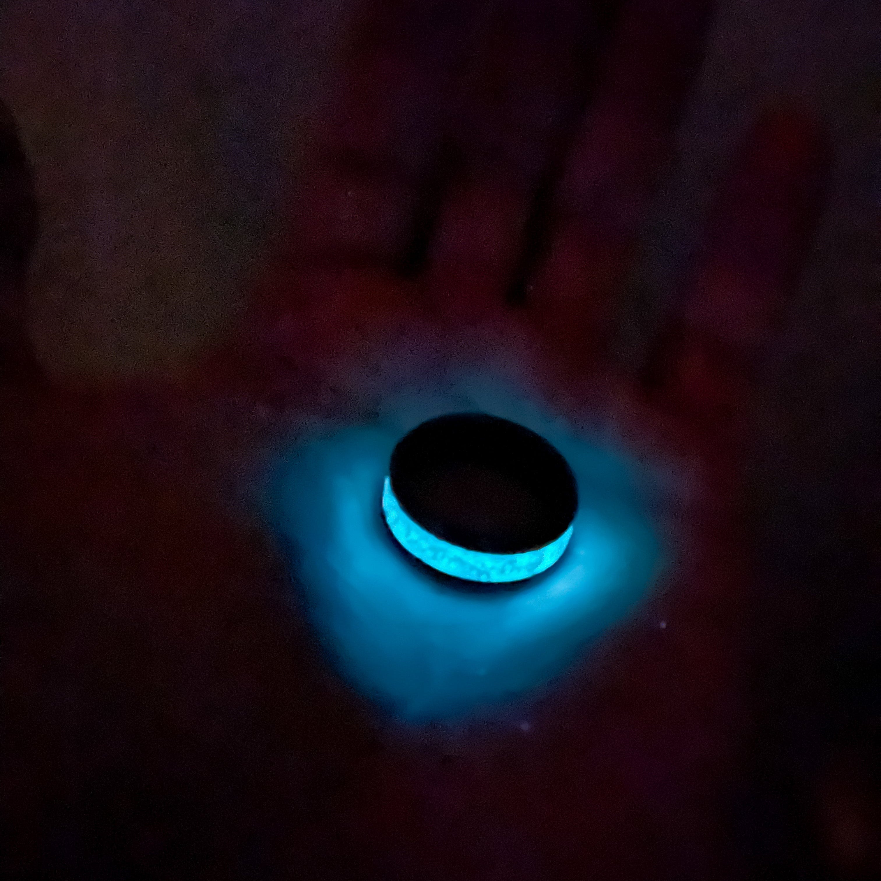 Handcrafted 8mm beveled black ceramic mens wedding band with authentic Triceratops bone and Campo del Cielo meteorite in teal opal teal glow inlay made in California