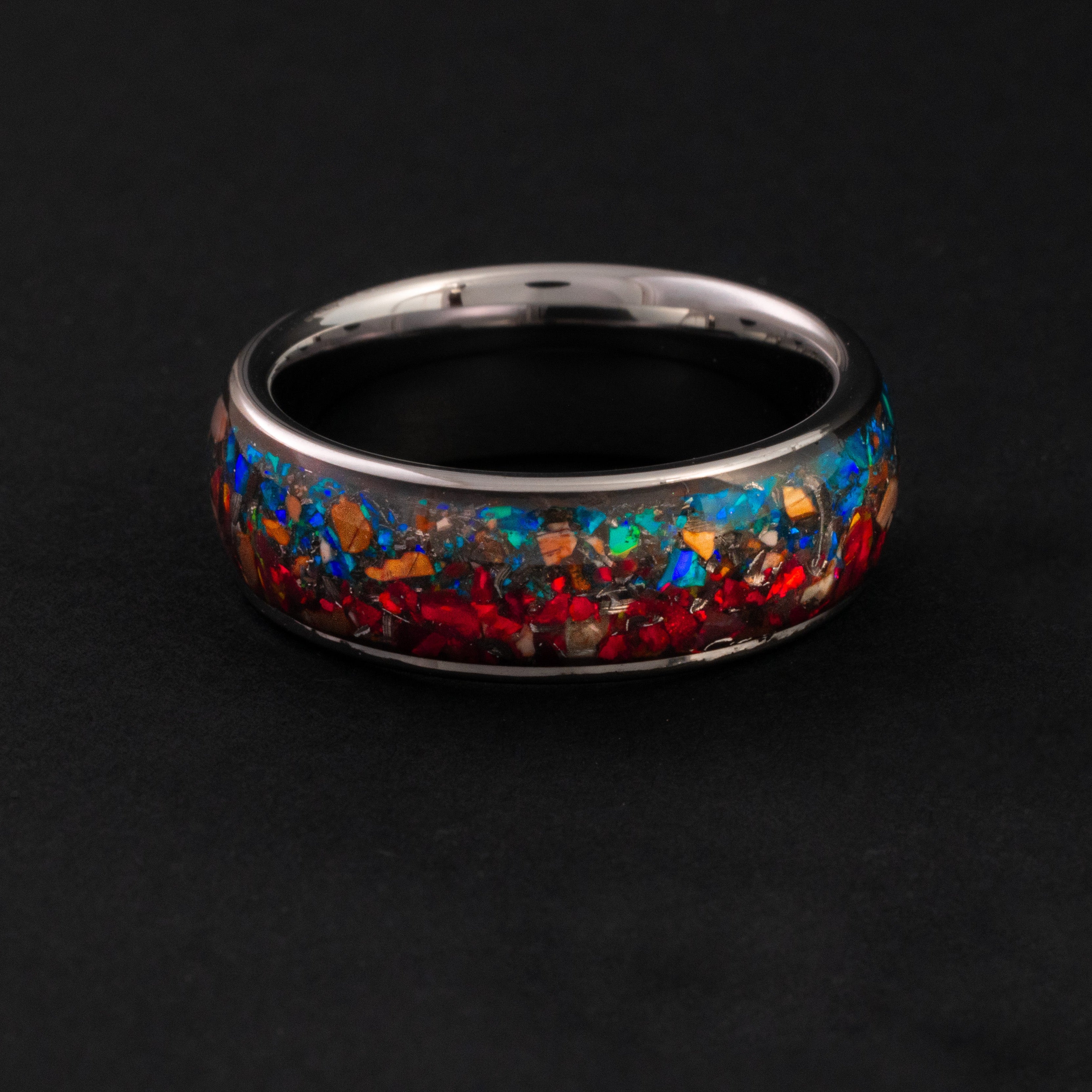 Handcrafted 8mm tungsten wedding band featuring prehistoric fossil and vibrant opal inlay.
