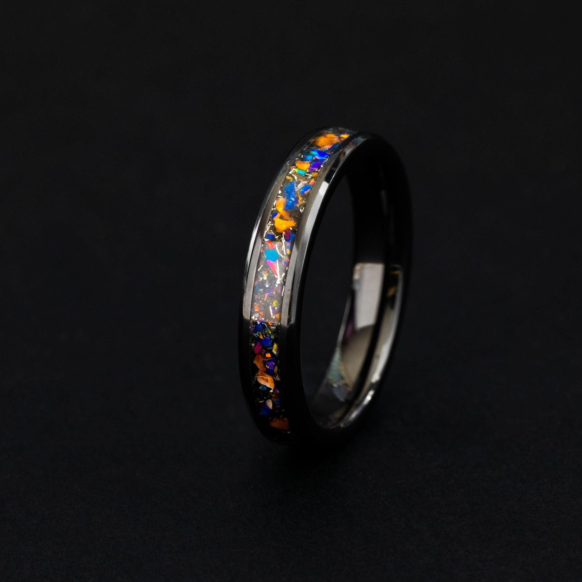 Close up of dinosaur bone and Campo del Cielo meteorite shavings in a 4mm ceramic ring.